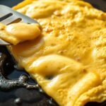 omelette cooking on griddle